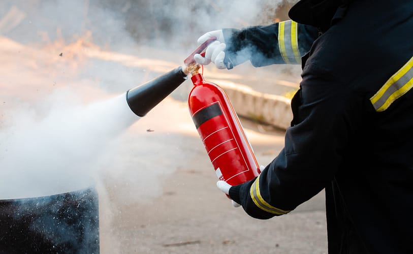 A man conducts exercises with a fire extinguisher. Fire extingui